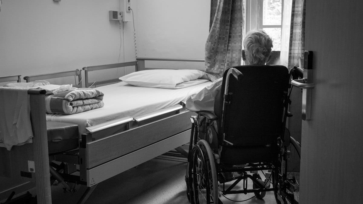 a person in a wheelchair in a room