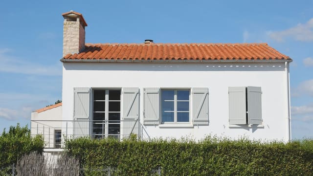 white and orange painted house