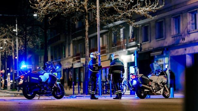 a group of motorcycles parked on the side of a road