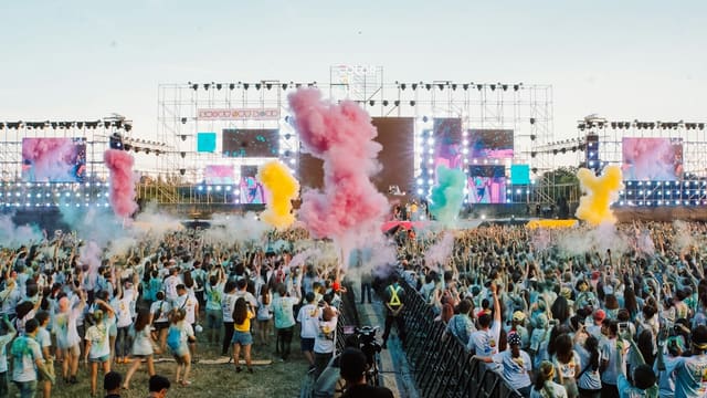people gathering on green grass field during daytime