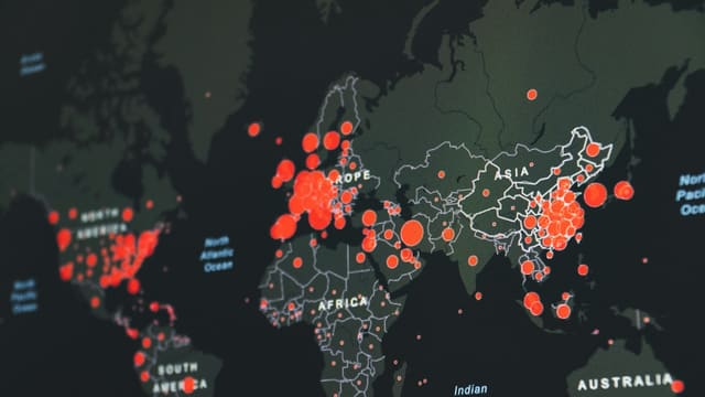 world map showing red infection clusters