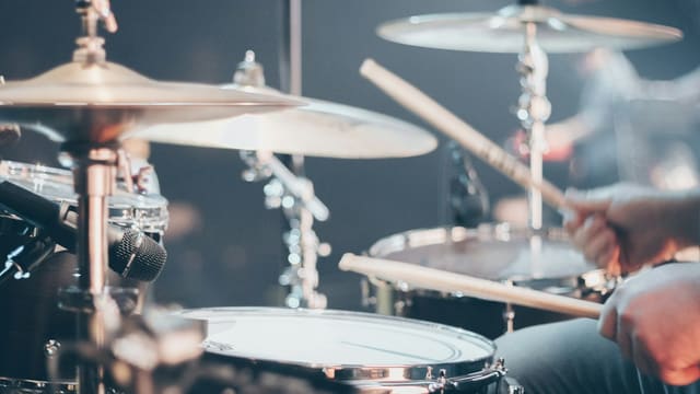 person playing drums