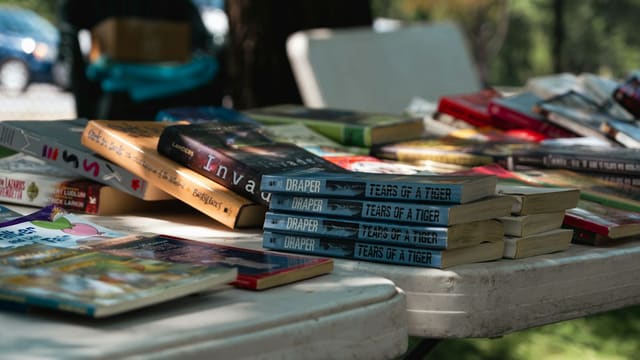a bunch of books that are sitting on a table
